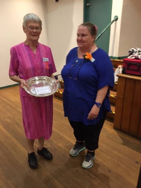 Bellarwi member, Margaret Smith receiving trophy for the best Fruit Cake at Land Cookery Day, with Marlene Clarke, Land Cookery officer.
