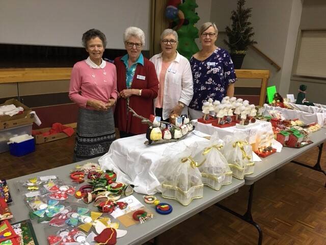 TREATS: The trading table of Christmas goodies, by members of Ariah Park - Robyn Furphy, Barbara Nation, Helen Judd and Diane Choice.