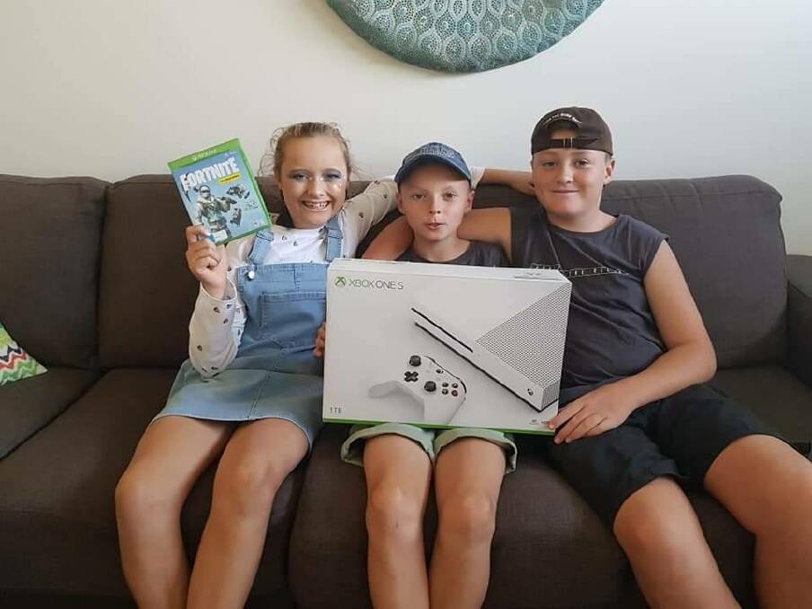 Charlotte Carlin, Noah Carlin and Samuel Carlin are excited to have a  new Xbox, courtesy of a community member. 
