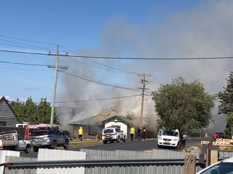 Emergency services respond to a house fire in Junee on Friday afternoon. Picture: Brian Riddell