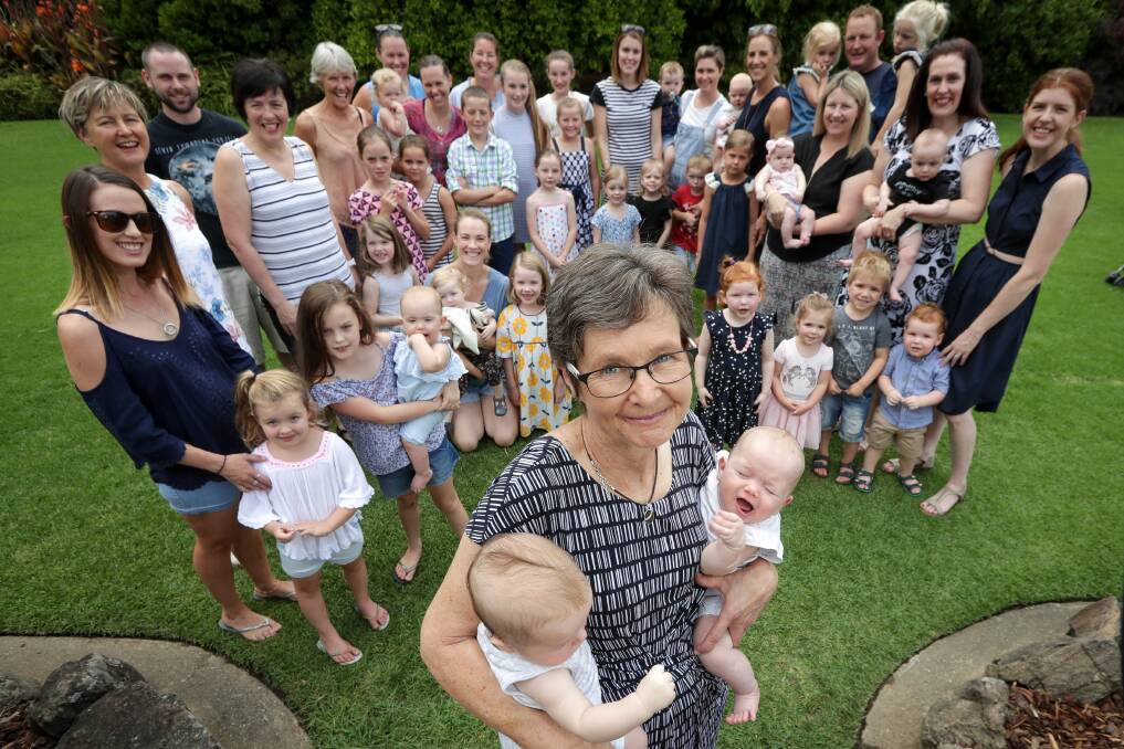 STAND-OUT: Jenny Ellis, with just a handful of the children she has delivered as a midwife, has received an Order of Australia Medal. Picture: JAMES WILTSHIRE