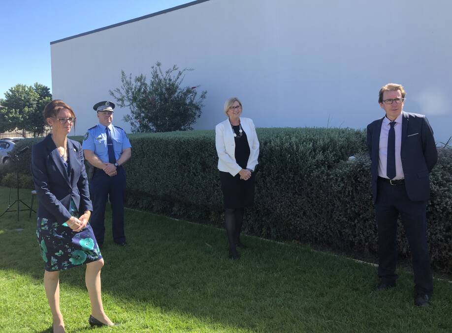 SOCIAL DISTANCING: Member for Cootamundra Steph Cooke, Superintendent Bob Noble, MLHD's Jill Ludford and Member for Wagga Joe McGirr keep their distance.