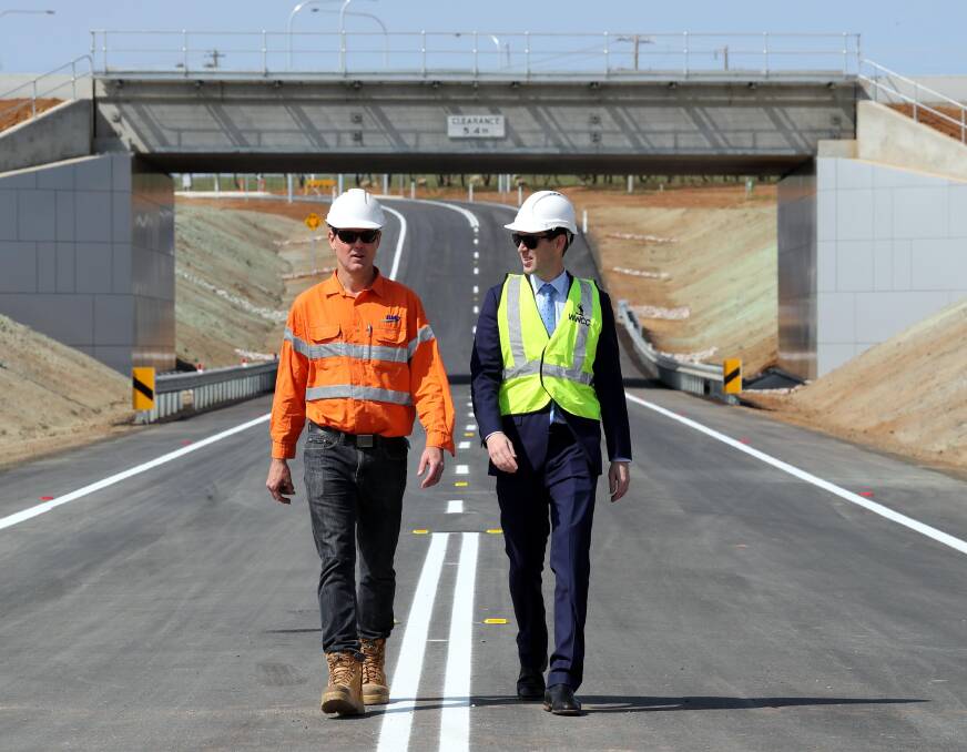 FREIGHT PLAN: BMD Constructions project manager Mark Gallagher with Wagga City Council project adviser James Bolton on one of the new roads at Bomen.