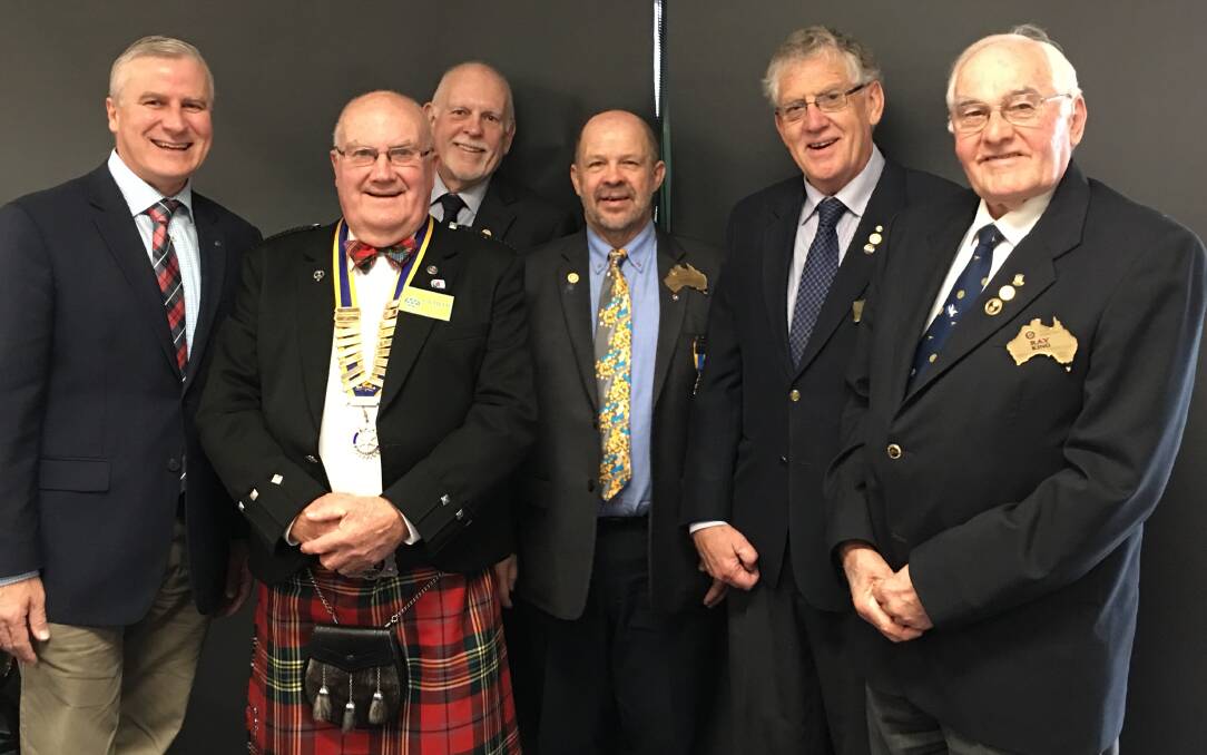 MP Michael McCormack, new president Graham Paton, MC Des Carmody, District 9700 Governor George Weston and past District Governors John Egan and Ray King. 
