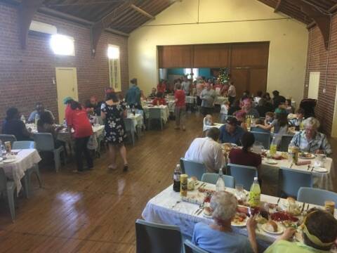 COMING TOGETHER: 70 people attended Junee's Community Christmas Lunch with organisers overwhelmed by the response. Picture: Contributed 