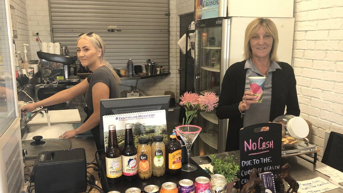 STILL HERE: Tearnna Mitchell and Jodie Coote continue to make breakfast and coffees for the Junee locals. Picture: Rachel McDonald
