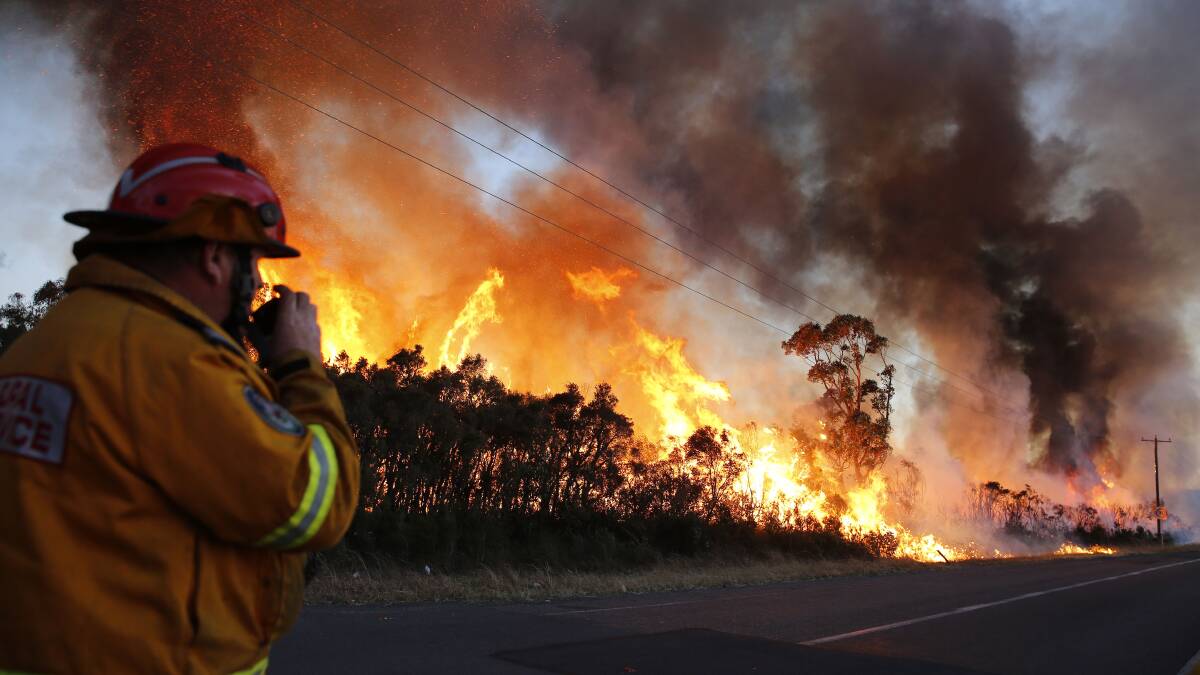 Fire crews back burn areas of bushland at Salt Ash, in the NSW Hunter region, on Sunday, August 19, 2018. Picture: AAP/Darren Pateman