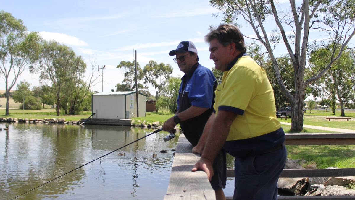 GOTTA CATCH 'EM ALL: Wayne Watterson and Tony Butt are hoping to tackle growing carp numbers in Lake Laurie Daley with a fishing competition in March. 
