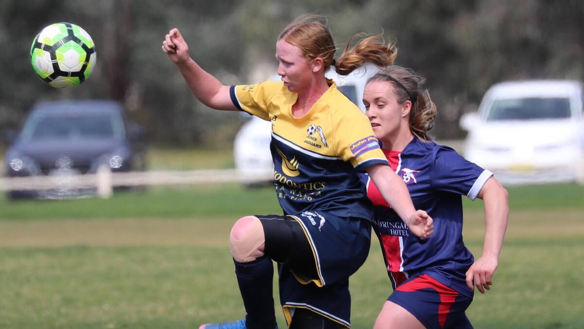 HARD-FOUGHT AFFAIR: Junee's Laine Seary tries to control a long ball under pressure from Henwood Park's Madeline Harris during the Leonard Cup semi finals. Picture: Les Smith