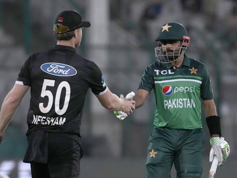 Pakistan's Babar Azam is congratulated by James Neesham on his century after his dismissal. (AP PHOTO)