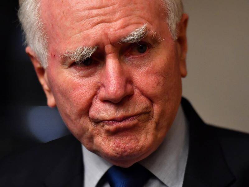 John Howard has questioned whether every soldier had to be withdrawn from Afghanistan.