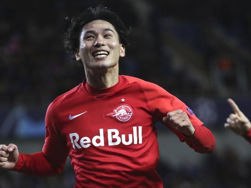 Salzburg's Japanese striker Takumi Minamino is closing in on a move to Liverpool.