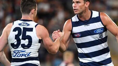 Patrick Dangerfield (L) and Tom Hawkins (R) will return for Geelong's clash with Brisbane. (Darren England/AAP PHOTOS)