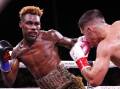 Jermell Charlo (l) stopped Brian Castano (r) in their super welterweight title rematch.