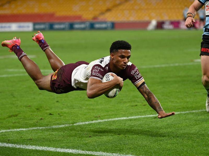 Jason Saab dives over to score during Manly's comfortable NRL win over the Sharks.