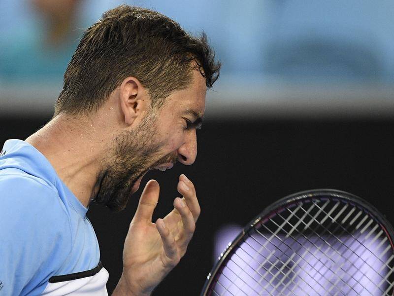 Defending finalist Marin Cilic has been knocked out of the Australian Open.