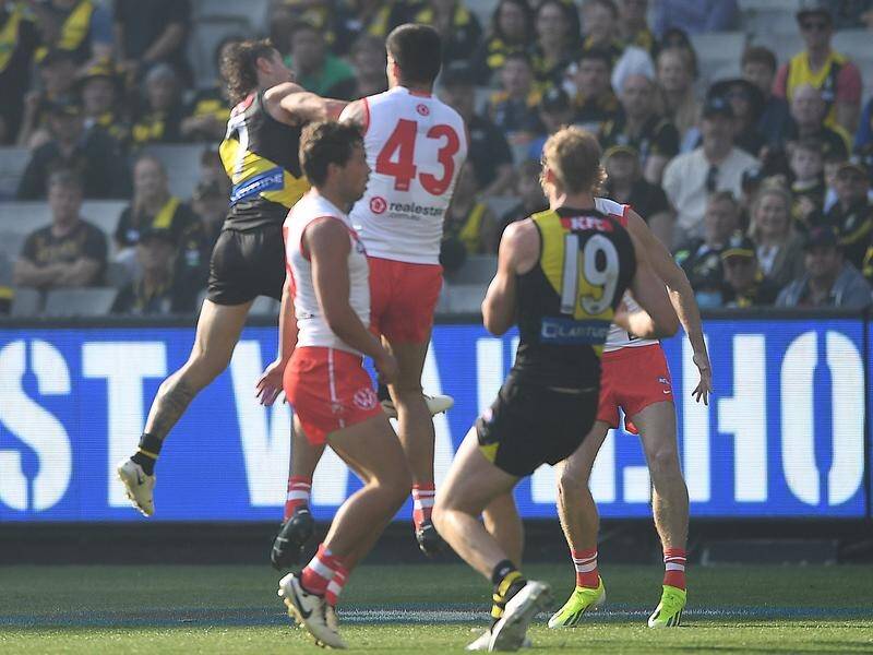 Richmond's Liam Baker (left) has failed to overturn his one-game ban for this bump on Lewis Melican. (Julian Smith/AAP PHOTOS)