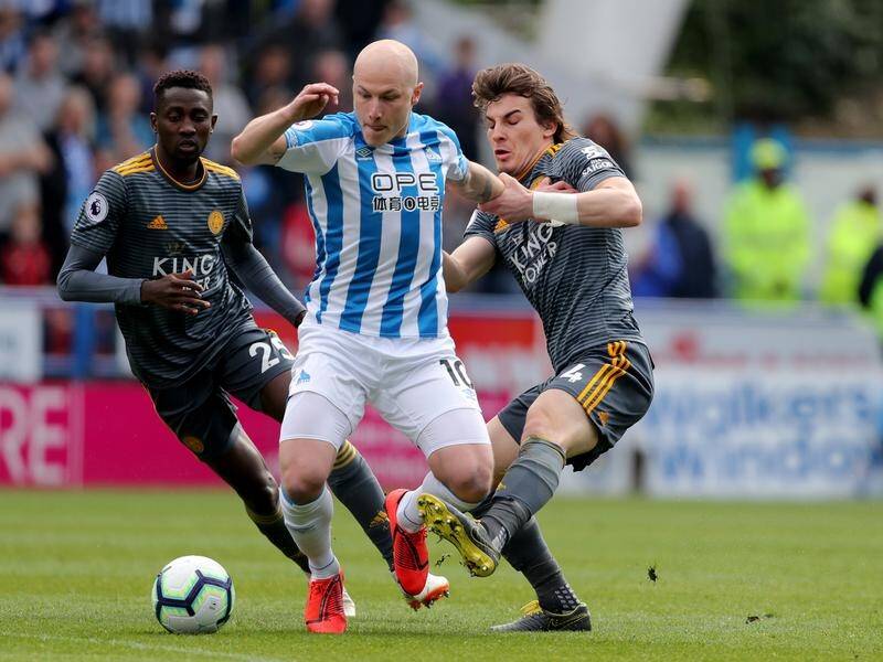 Huddersfield Town's Aaron Mooy will miss Friday's clash with Liverpool due to injury.