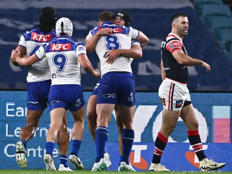 James Tedesco (right) was concussed during the Bulldogs' first-half onslaught against the Roosters. (James Gourley/AAP PHOTOS)