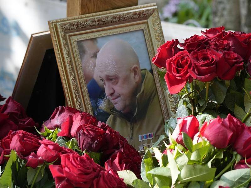 Followers of Yevgeny Prigozhin have laid flowers and messages at his grave in St Petersburg. (AP PHOTO)