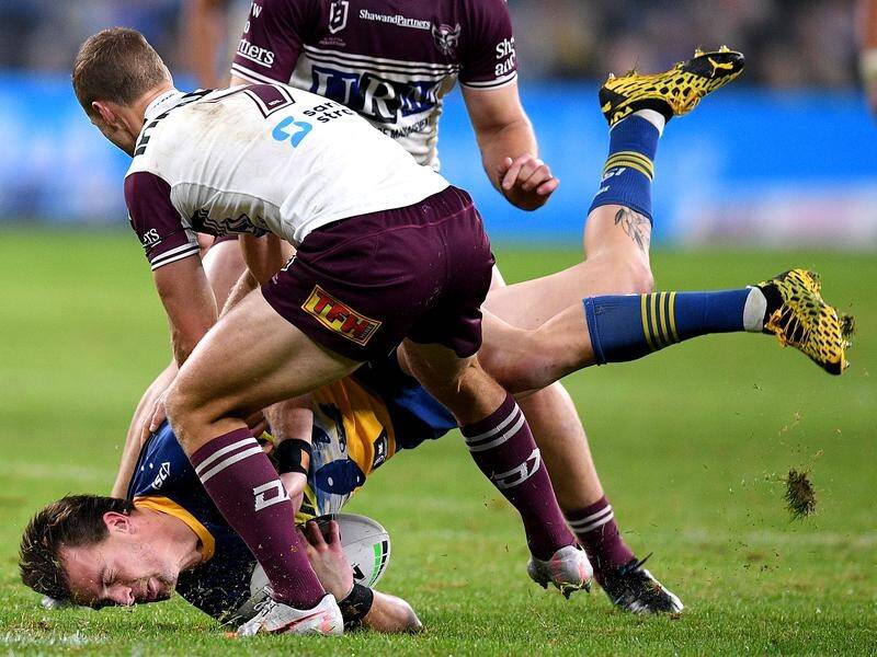 Eels' Clint Gutherson Is tackled by Daly Cherry Evans of the Sea Eagles in Saturday's NRL clash.