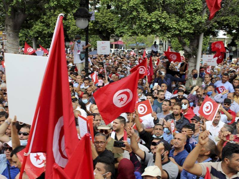Protests reflect an increasingly visible rift in Tunisian society over the president's actions.