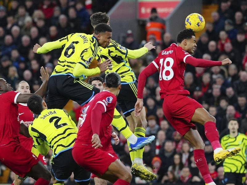 Arsenal defender Gabriel (top left) heads his side in front in the 1-1 draw at Anfield. (AP PHOTO)