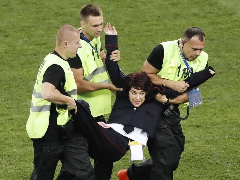 Four protesters who invaded the turf during the World Cup final are facing 15 days in prison.