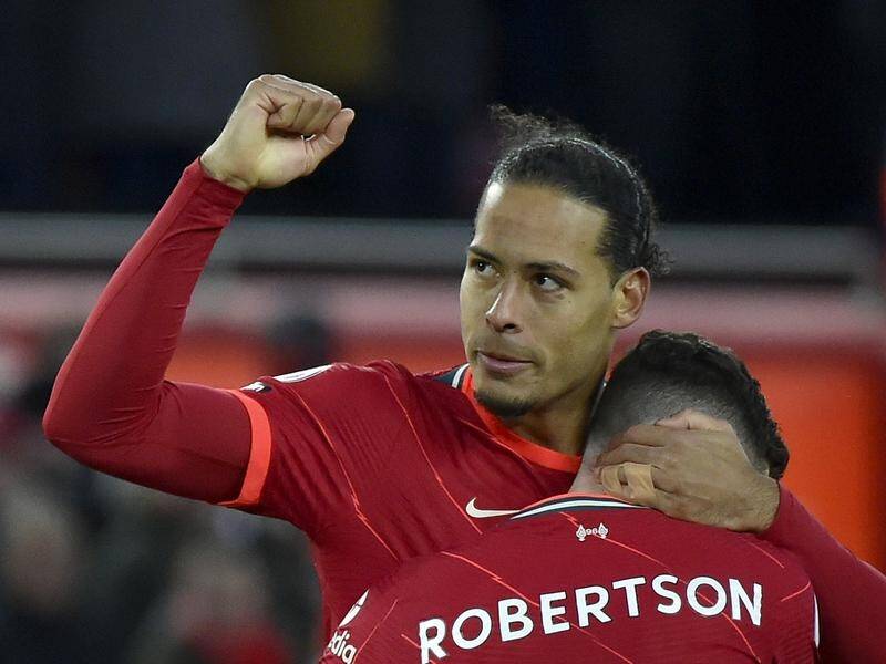 Liverpool's Virgil van Dijk celebrates with Andrew Robertson after scoring against Southampton.