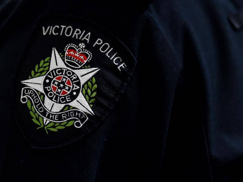 A Victoria Police officer will face charges, including letting an unlicensed person carry a gun.