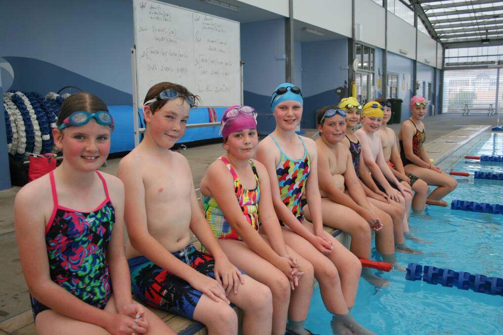 Putting in the distance during Junee Swimming Club trainer are swimmers (from left), Judy Hopkins, 9, Alex Reader, 14, Madeleine Commins, 9, Mim Hopkins, 11, Lachlan Payne, 11, Mia Phillips, 10, Connor Barrett, 11, Oliver Phillips, 11 and Jasmine Phillips, 12. Picture: Declan Rurenga