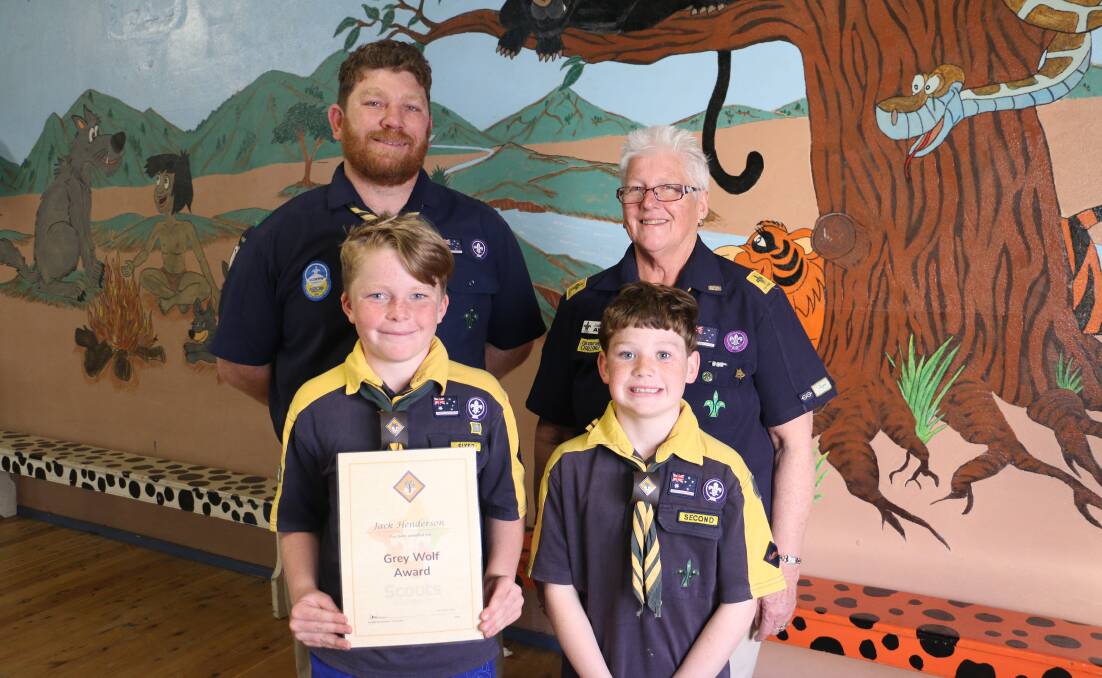 HIGH ACHIEVERS: Jack Henderson, 10 and Bryce Wattie, 10, show off their awards with proud scout leader Daniel Wattie and cub leader Jackie Starr. Picture: Jessica McLaughlin