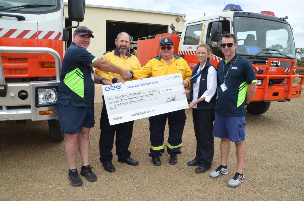 GRATEFUL: Michael Perkins, Brett Porter, Paul Armour, Ainslie Wood and Daniel Halliburton exchange the donation from inmates at the Correctional Centre. Picture: Contributed