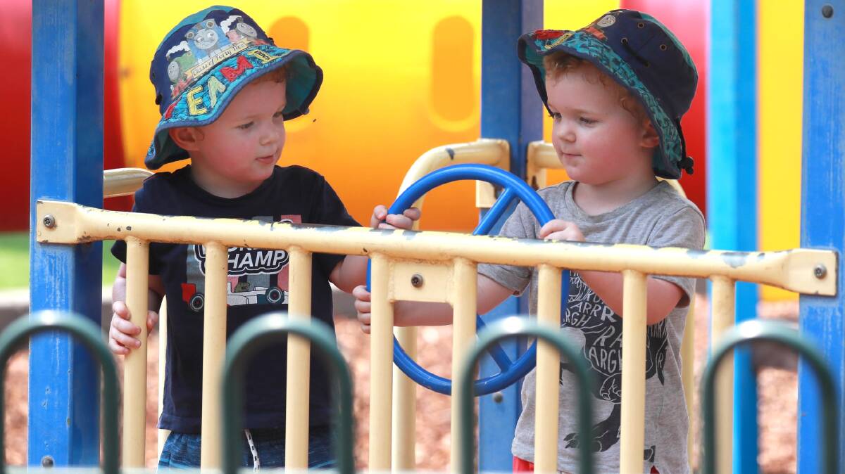 Two-year-old twins from Tumbarumba, Joey and Josh McGrath, play at a Wagga Family Day Care hosted event. Picture: Les Smith