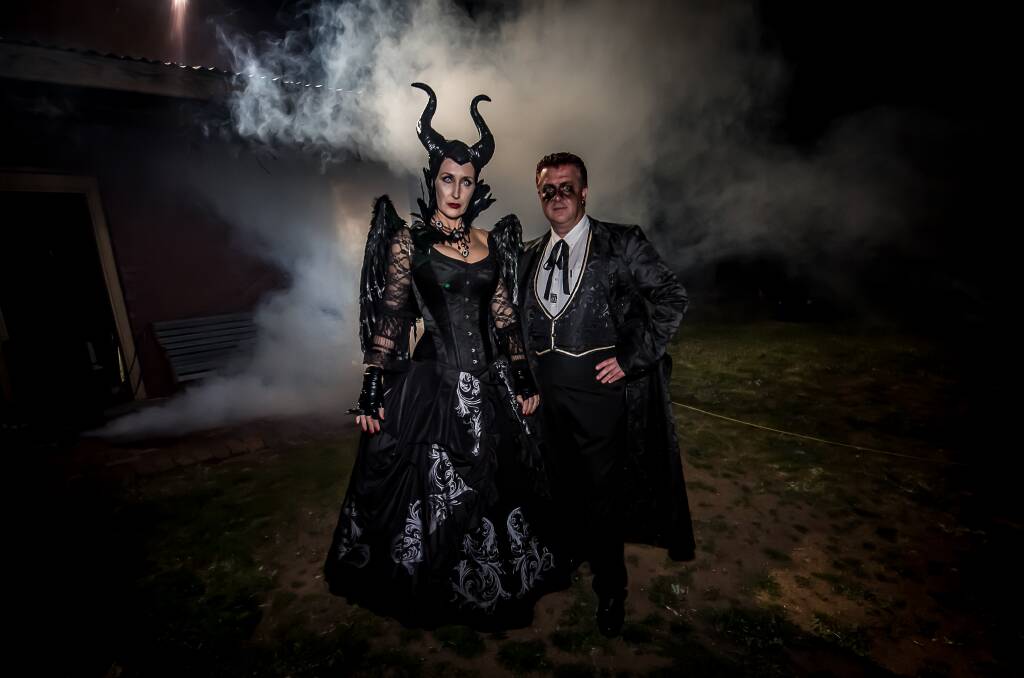 SPOOKY: Lawrence and Silvia Ryan dress for the occasion, with Silvia channeling a Maleficent theme and Lawrence going for an outfit of days gone by.