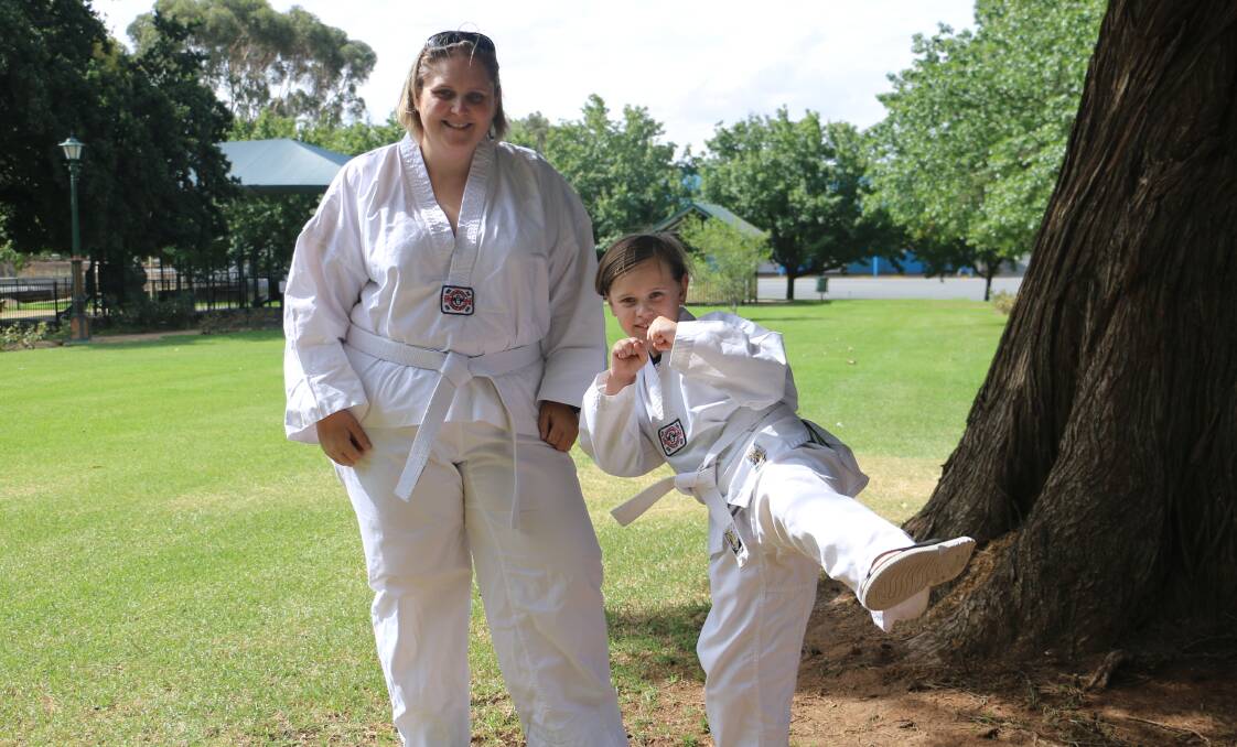STRENGTH: Mistie Disbrey and daughter Emmerson Disbrey, 8, empower each other through taekwondo. Picture: Jessica McLaughlin