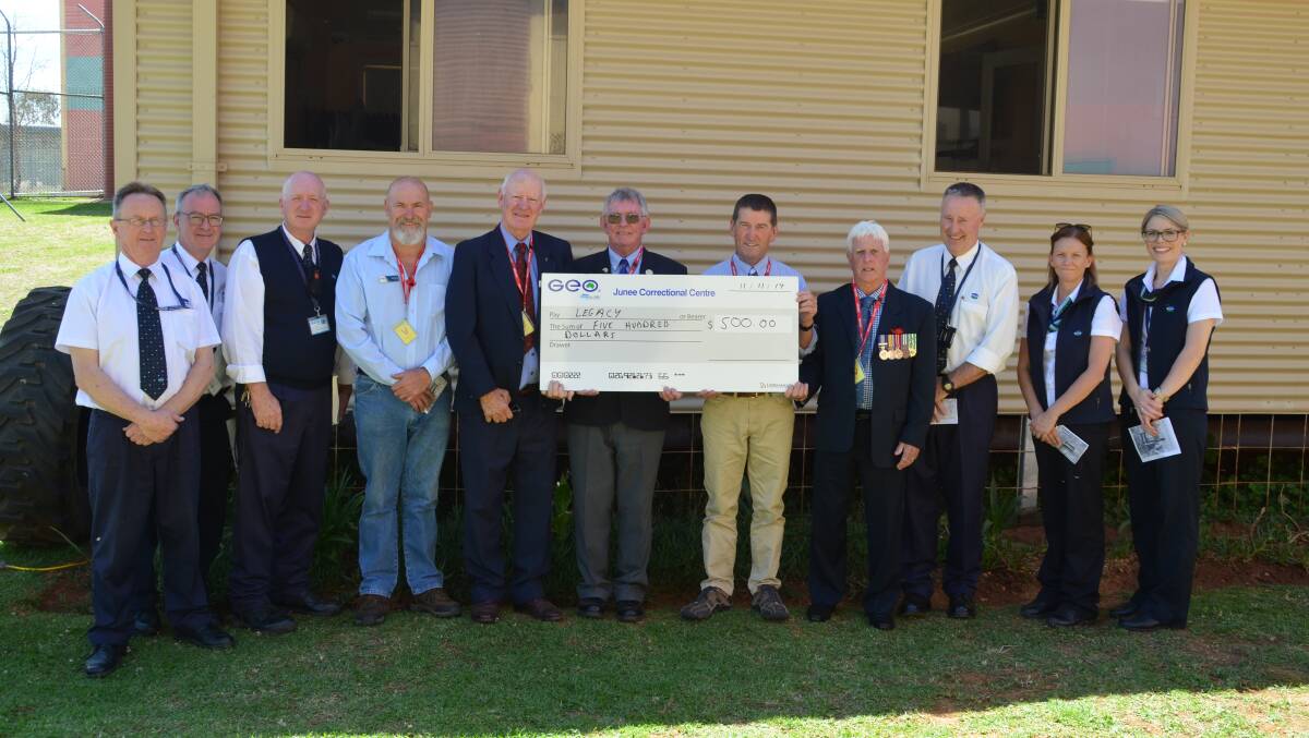 The Junee community accept the check from correctional centre staff. Picture: Contributed