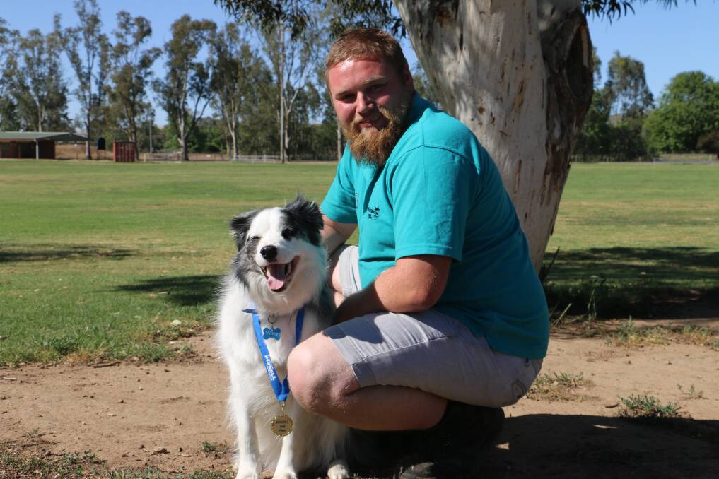 Wiley with owner Nick Barker, showing off his medal. Picture: Jessica McLaughlin