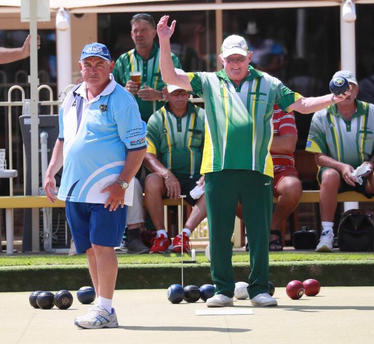 TIGHT COMPETITION: Wagga Rules Club's Keith Browne is pleased with his bowl, seeing Junee Bowling Club's Richard Thomas assess his next move. Picture: Les Smith