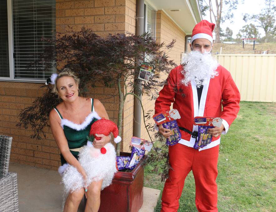 IN THEME: Julie Shepherd and Rodney Reberger get into the Christmas spirit with some friendly competition between neighbours. Picture: Jessica McLaughlin