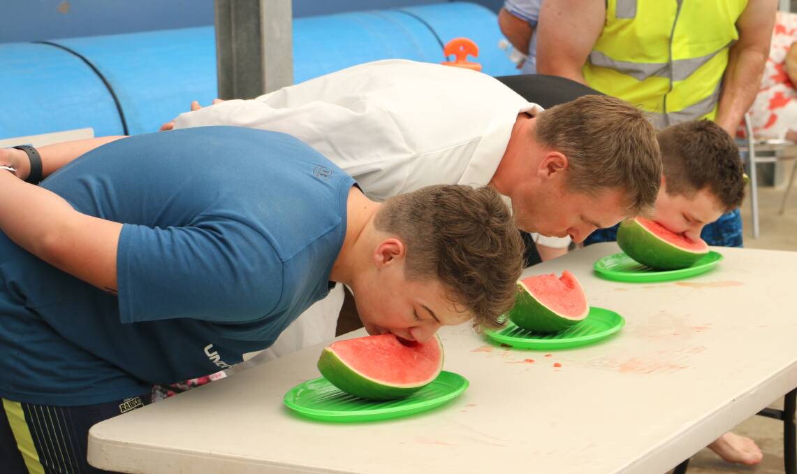 EAT UP: All mouths on deck to kickstart the relay race with a watermelon eating competition. Picture: Jessica McLaughlin