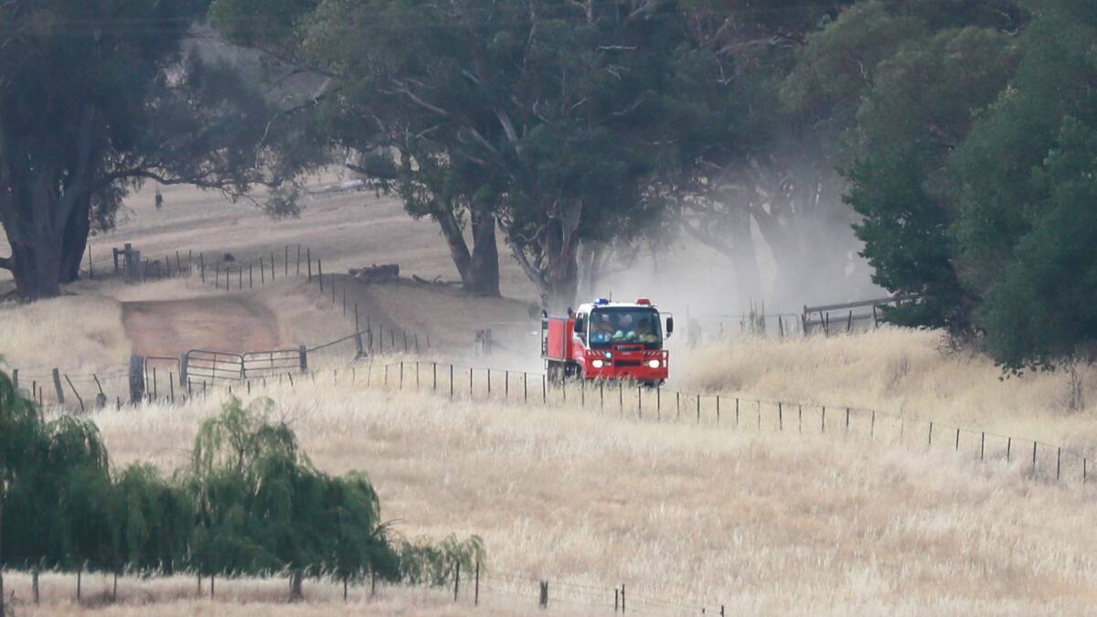 Junee RFS truck makes it's way along Stewart's Road during the Dunns Road fire. Picture: Les Smith