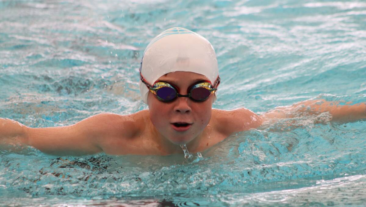 CHAMPION: 11-year-old Oscar gives his best effort as he takes out the top spot for his age group with a speedy butterfly swim. Picture: Contributed | MORE CARNIVAL PICTURES: PAGE 7