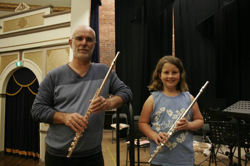 Junee Town Band's conductor and flautist Keith Griffin with Lexi Lamb get some practise in at the Athenium. Picture: Declan Rurenga