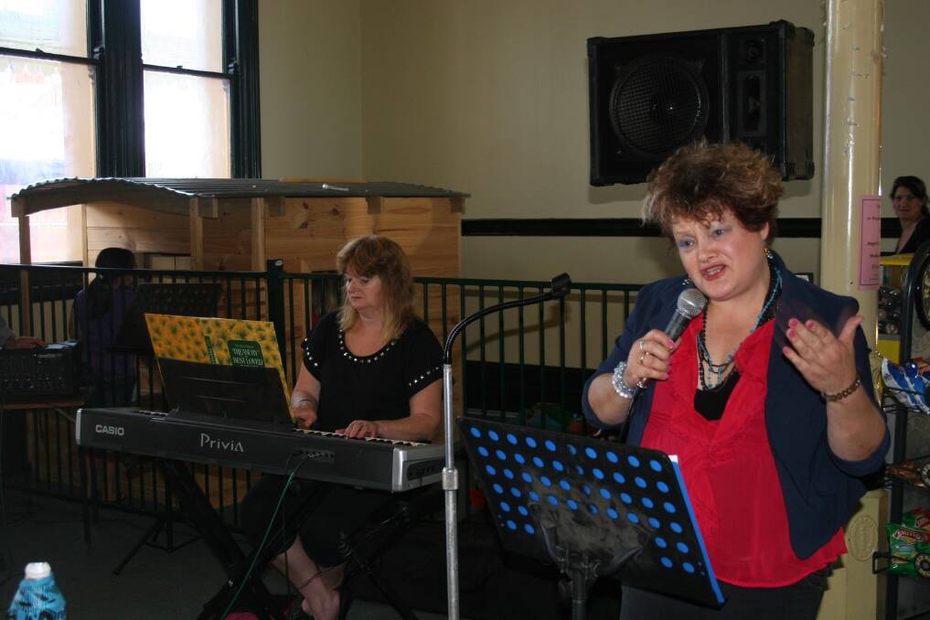 Junee's Judy-Ann Emberson performs in the Railway Cafe with backing from Nikki Ingram during the Rhythm 'n' Rail Festival.