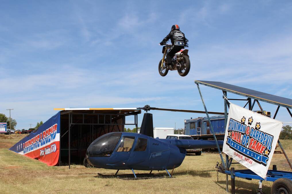 Lawrence Legend jumps a helicopter for the Tubby's Ride charity run when it stopped in Junee last weekend. 